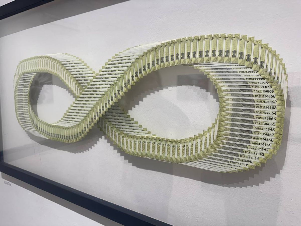Art installation made from Indian rupee notes in infinity symbol