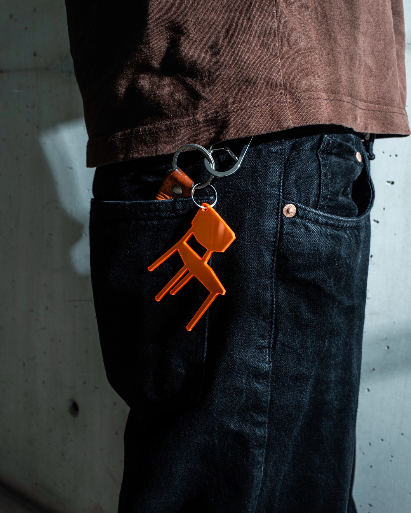 Orange WALK WITH ME chair-shaped keychain