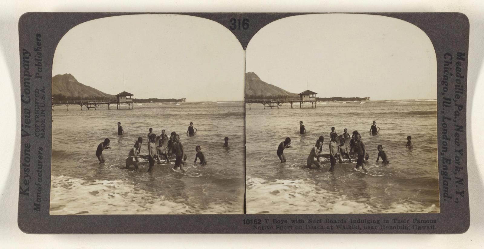 Boys with Surf Boards Indulging in Their Famous Native Sport on Beach at Waikiki, near Honolulu, Hawaii