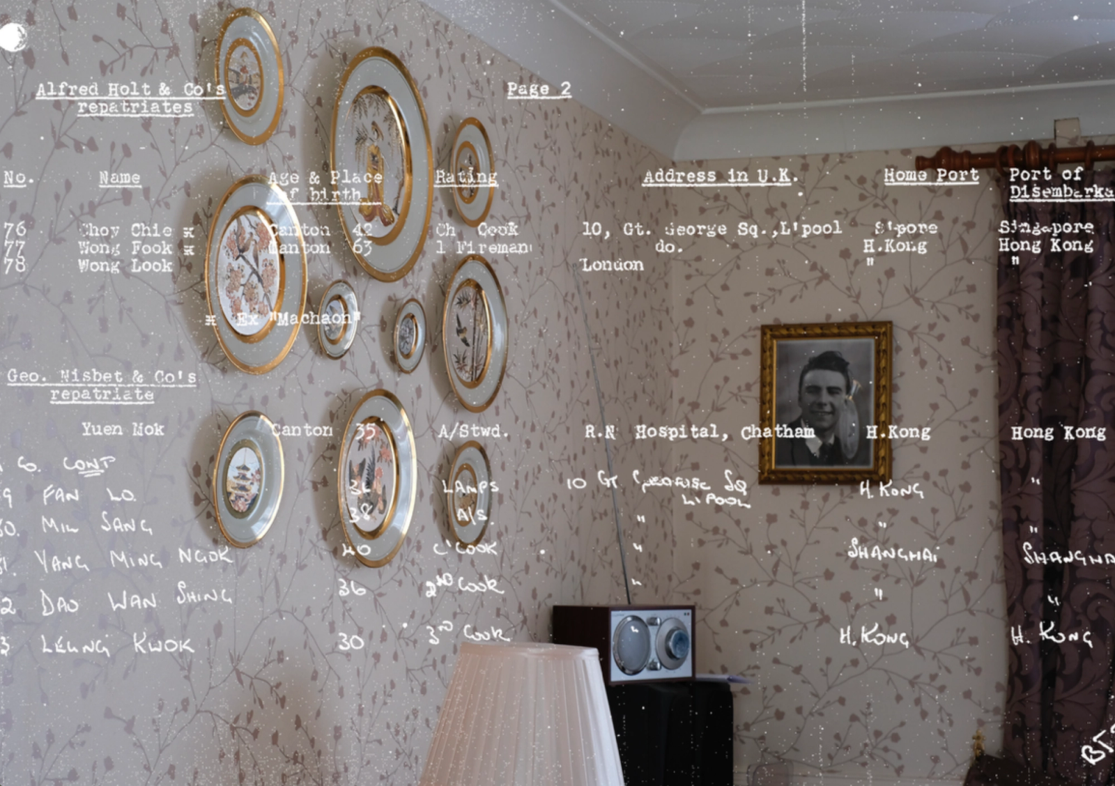 A room with floral wallpaper, a framed portrait and decorative plates, overlaid with typed lists of seamen's names and home ports.
