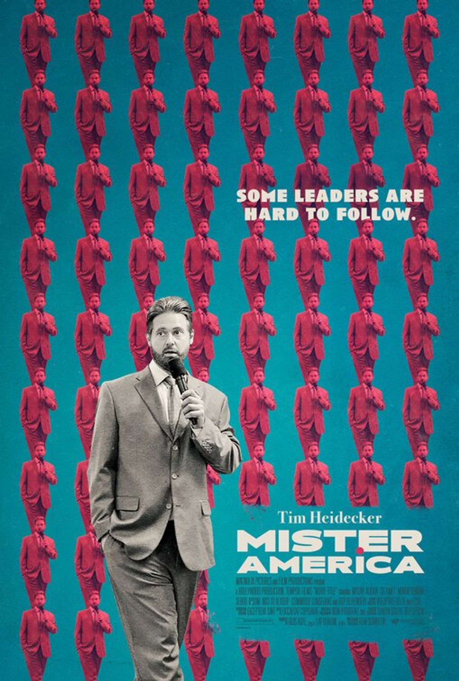 Poster for Mister America: Tim Heidecker in a grey suit holds a microphone against a repeating pattern of pink figures.