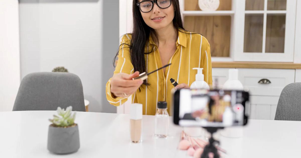 Beauty influencer filming a product review at home, illustrating strategies to choose the right influencer for your brand.