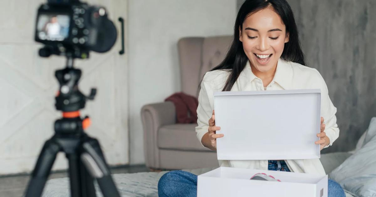 Female beauty KOL unboxing product on camera for marketing campaign types of KOLs