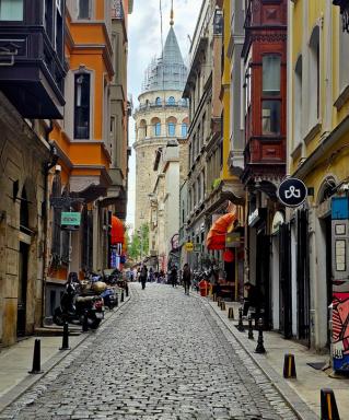 A cobblestone street in Galata leading toward Galata Tower