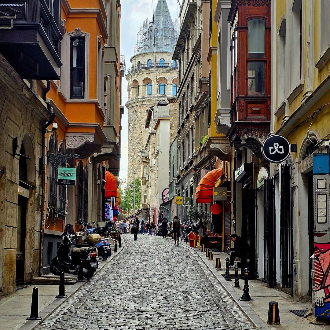 A cobblestone street in Galata leading toward Galata Tower