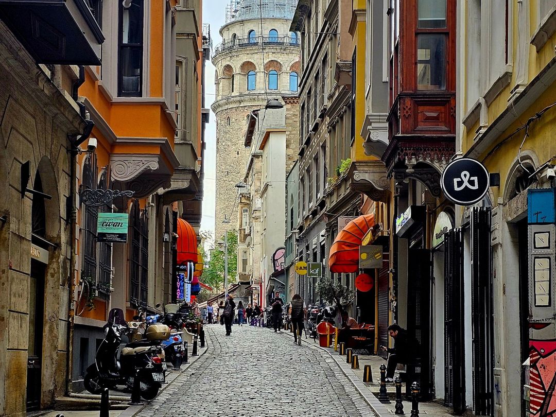 A cobblestone street in Galata leading toward Galata Tower