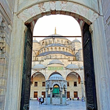 A gateway framing the Blue Mosque's domes and minarets in Istanbul's Sultanahmet