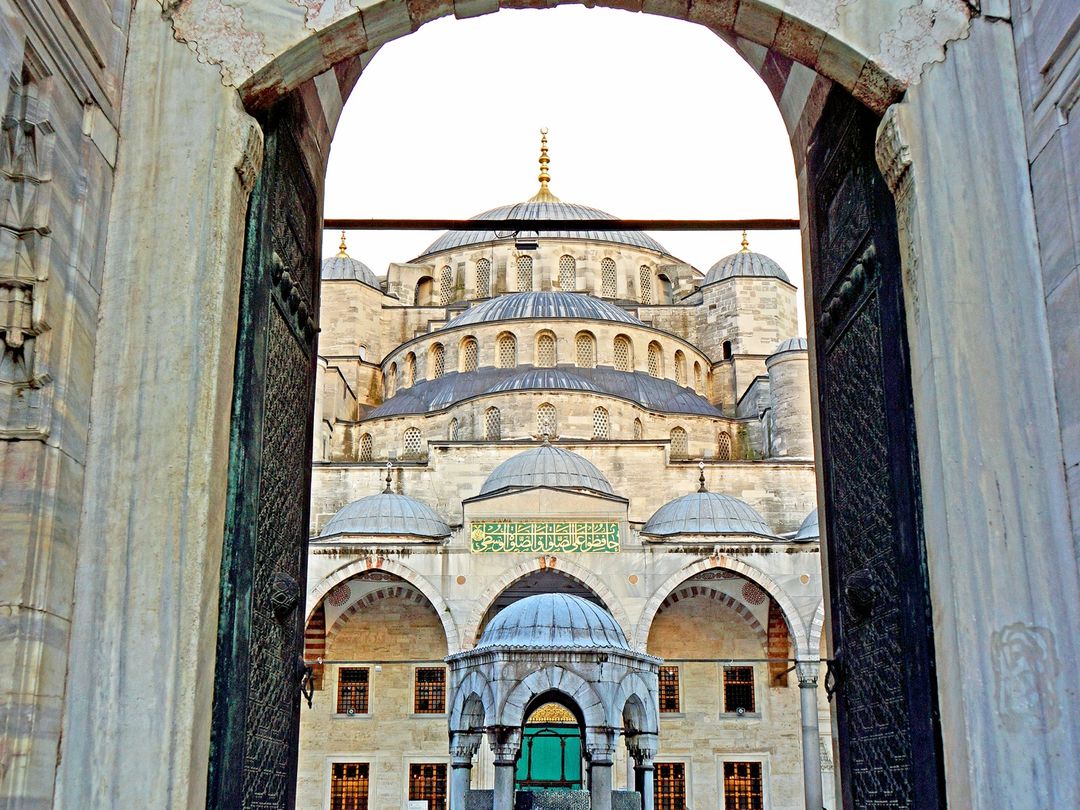 A gateway framing the Blue Mosque's domes and minarets in Istanbul's Sultanahmet