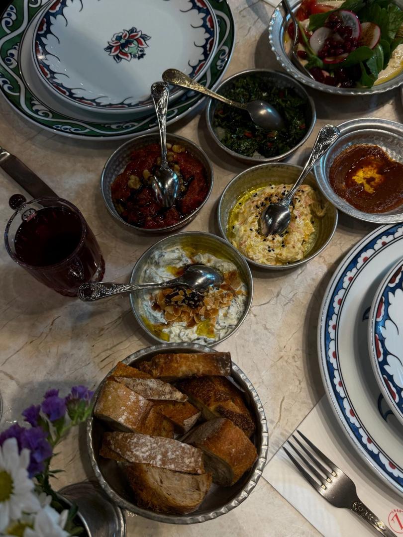 A shared table of Turkish meze dishes and bread