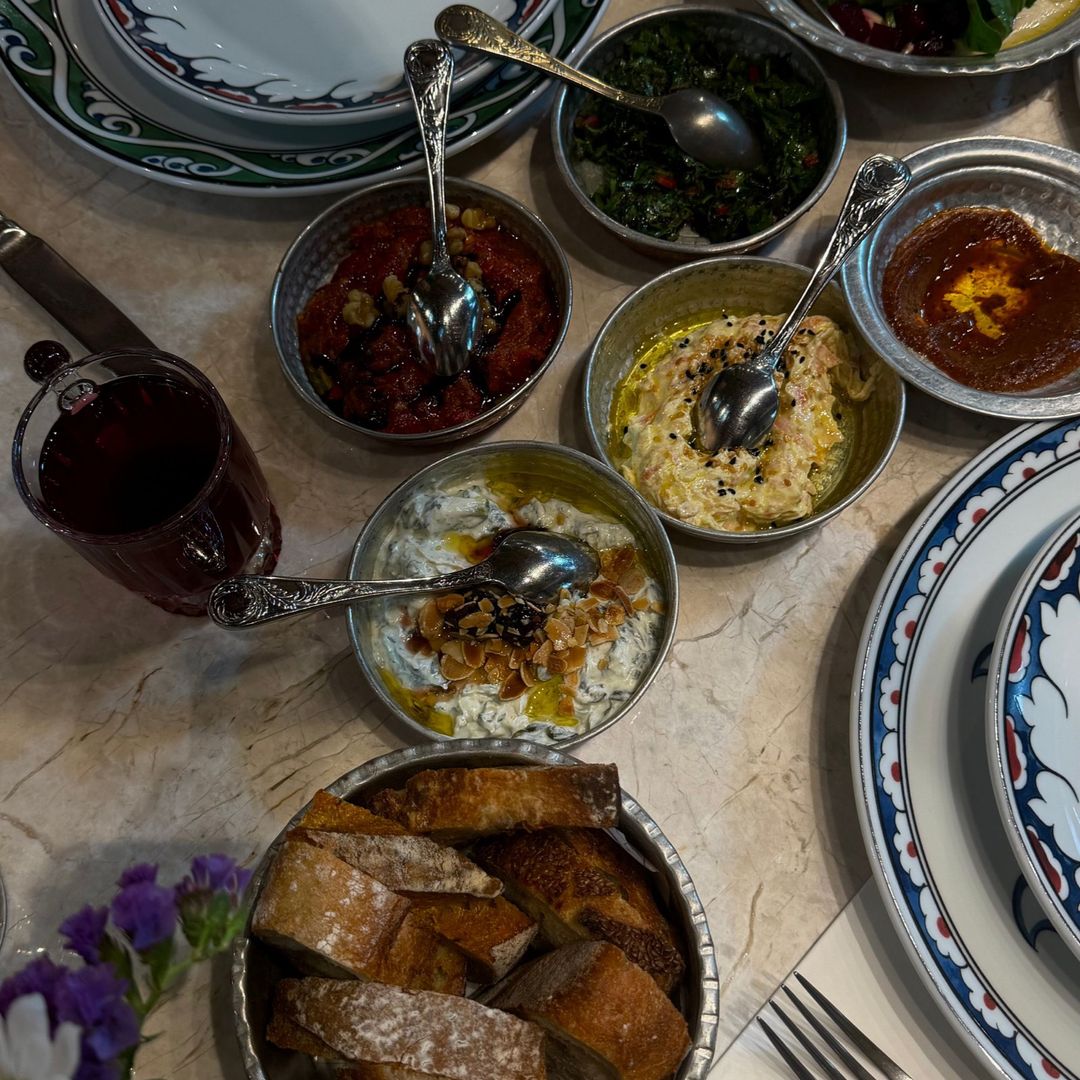 A shared table of Turkish meze dishes and bread
