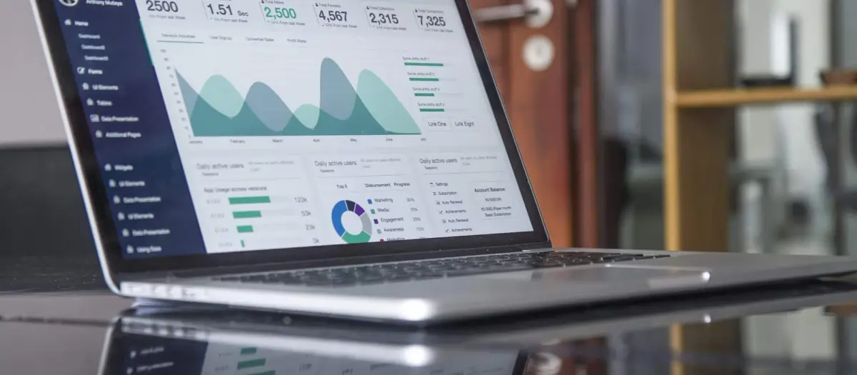 A laptop witn marketing report displayed on it.