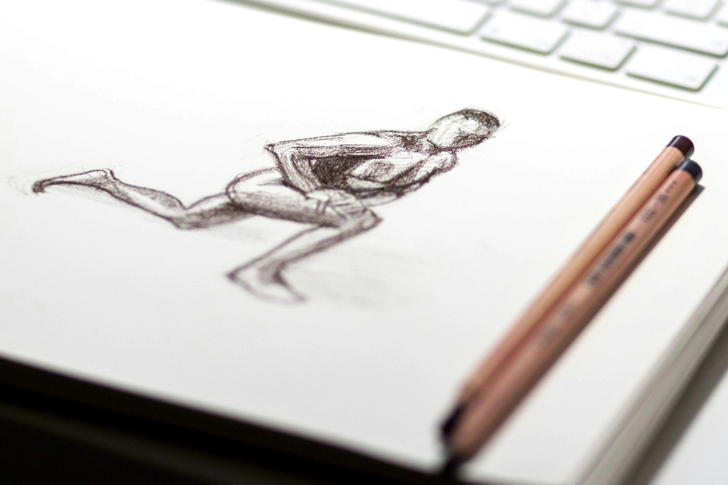 A page featuring a pencil sketch of a person stretching, getting ready to run