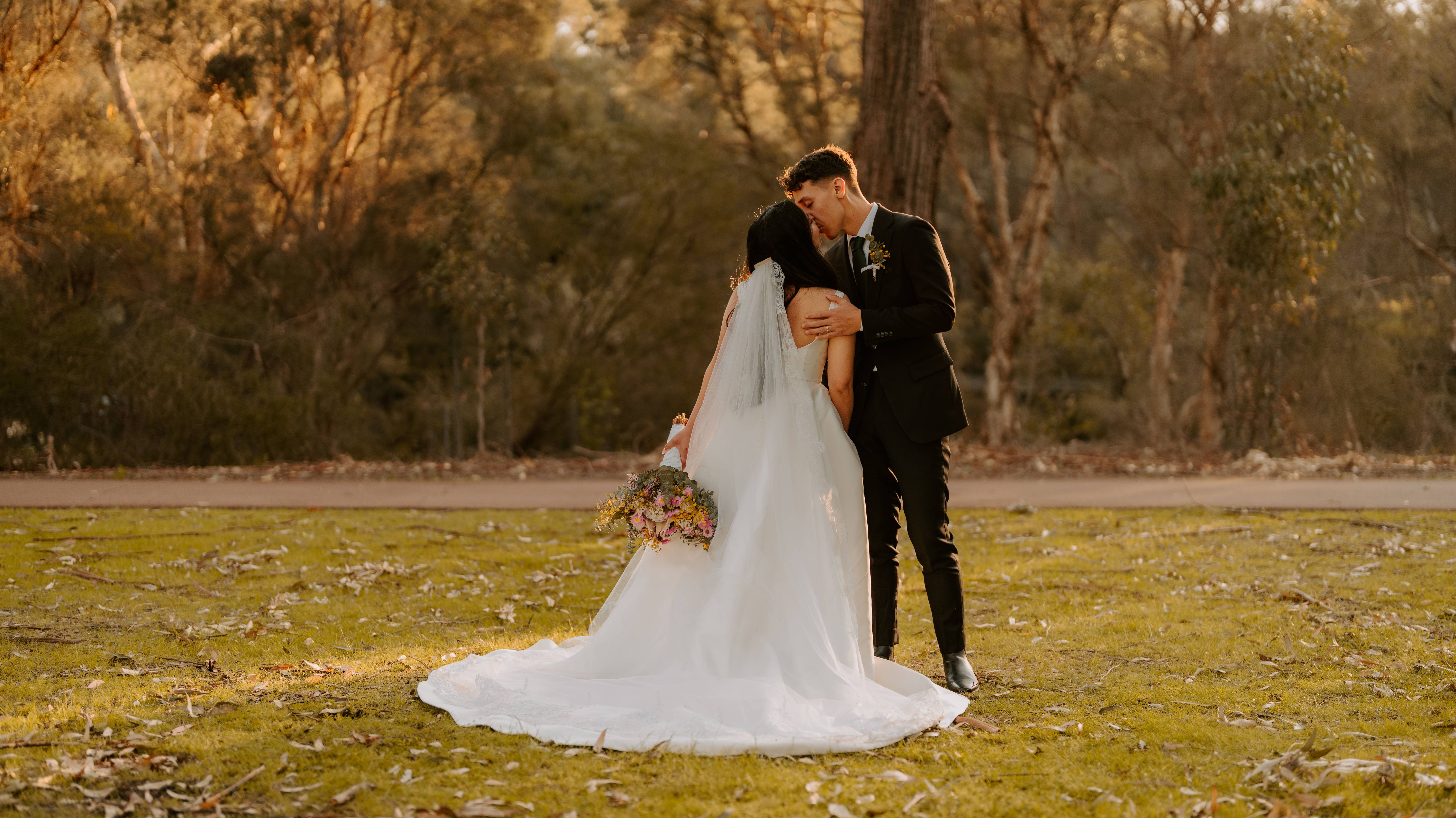 Kissing scene of two newly wed
