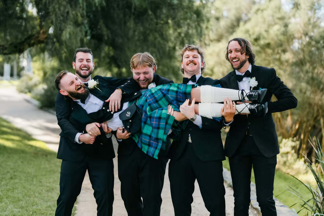 Group of men smiling