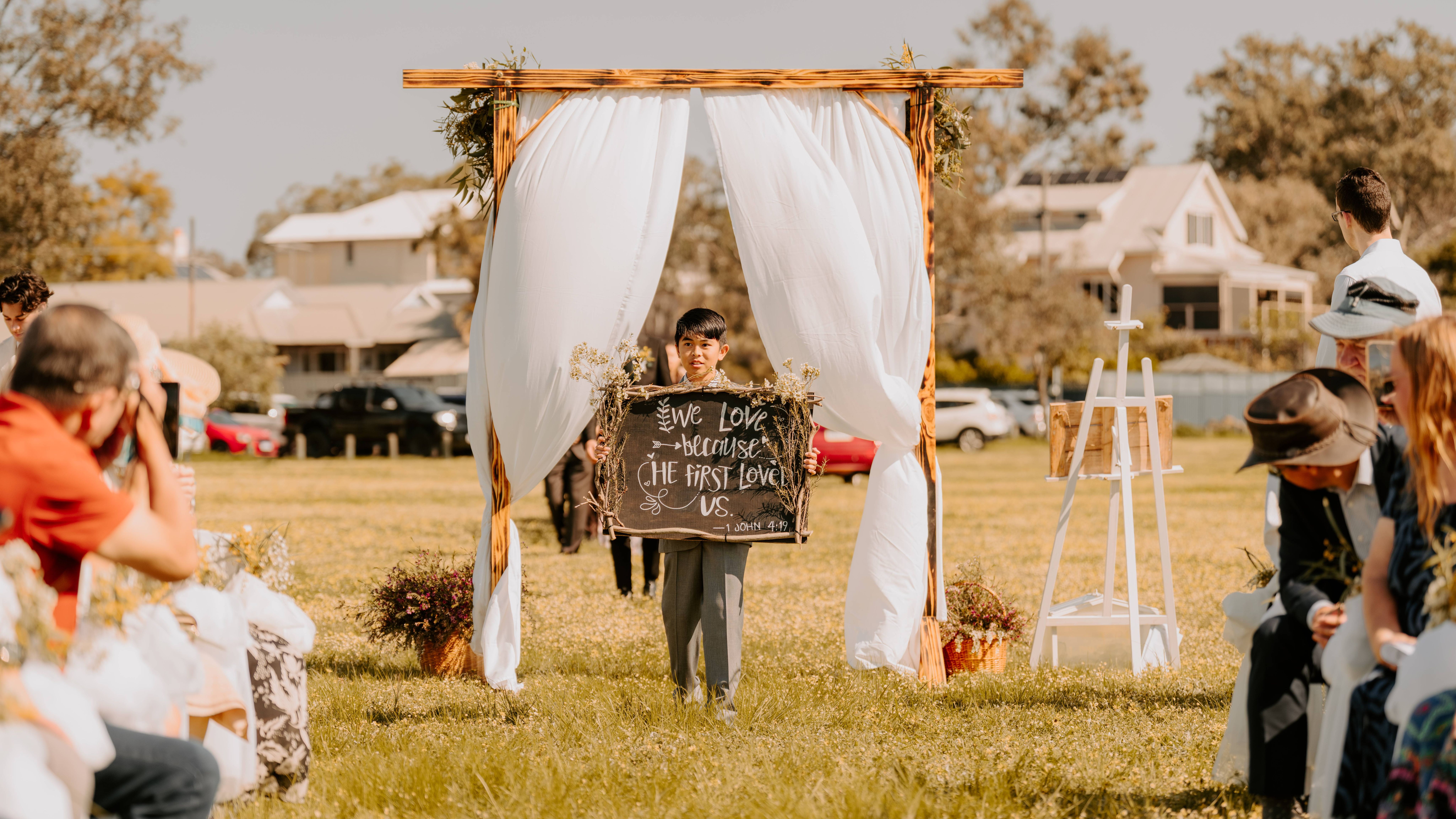 A baby walking; wedding ceremony