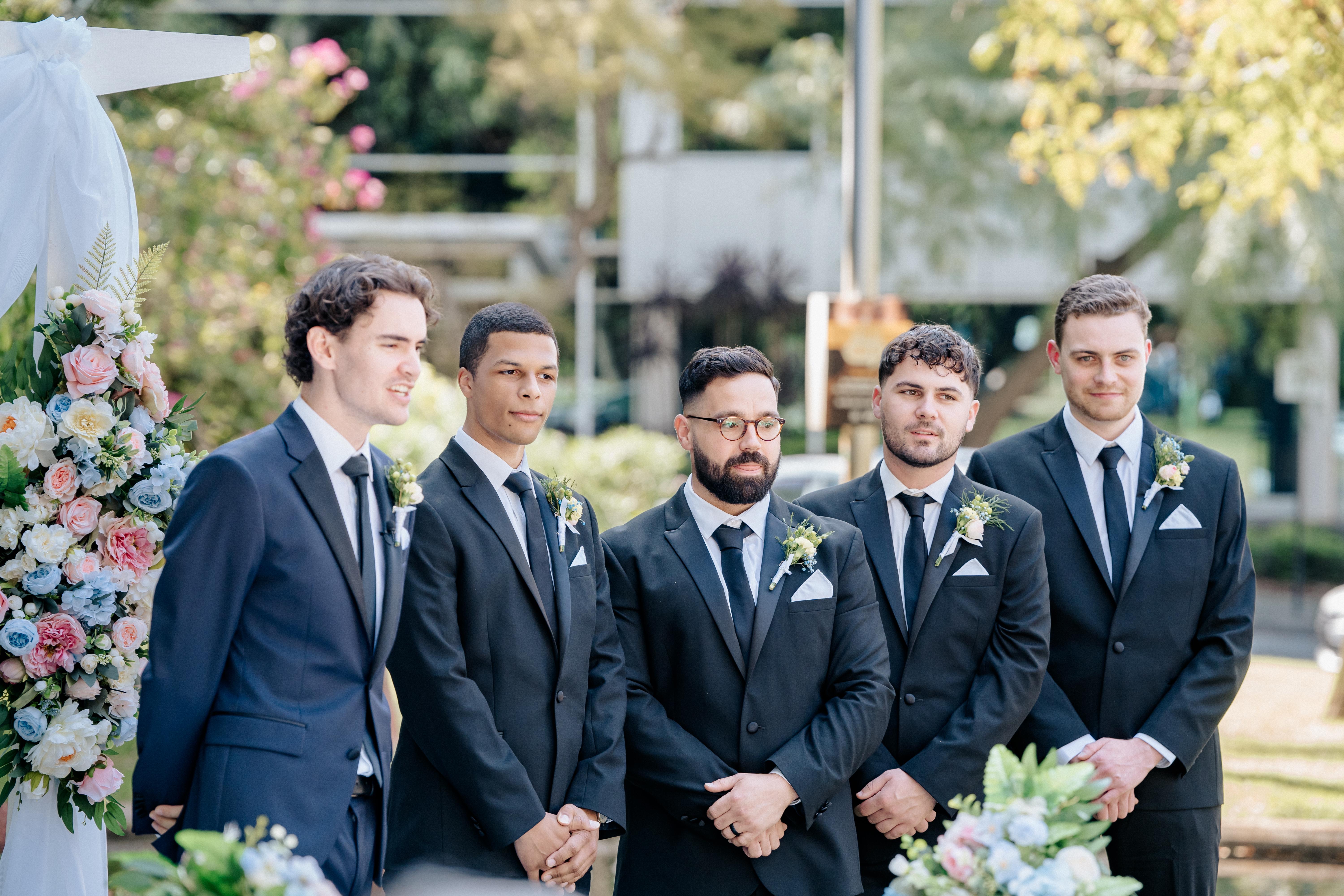 A group of groom standing