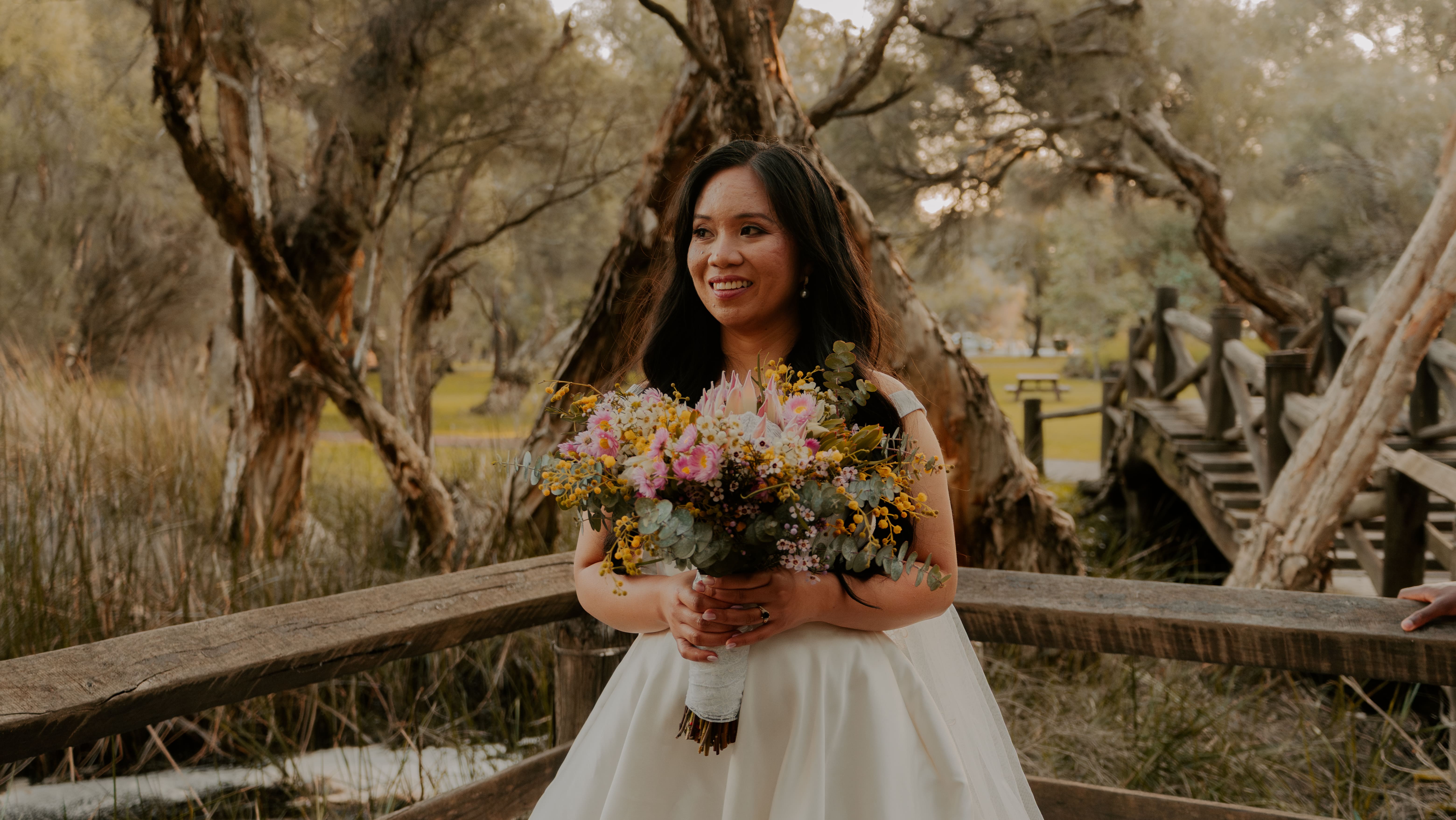 A bride waiting holding a flower