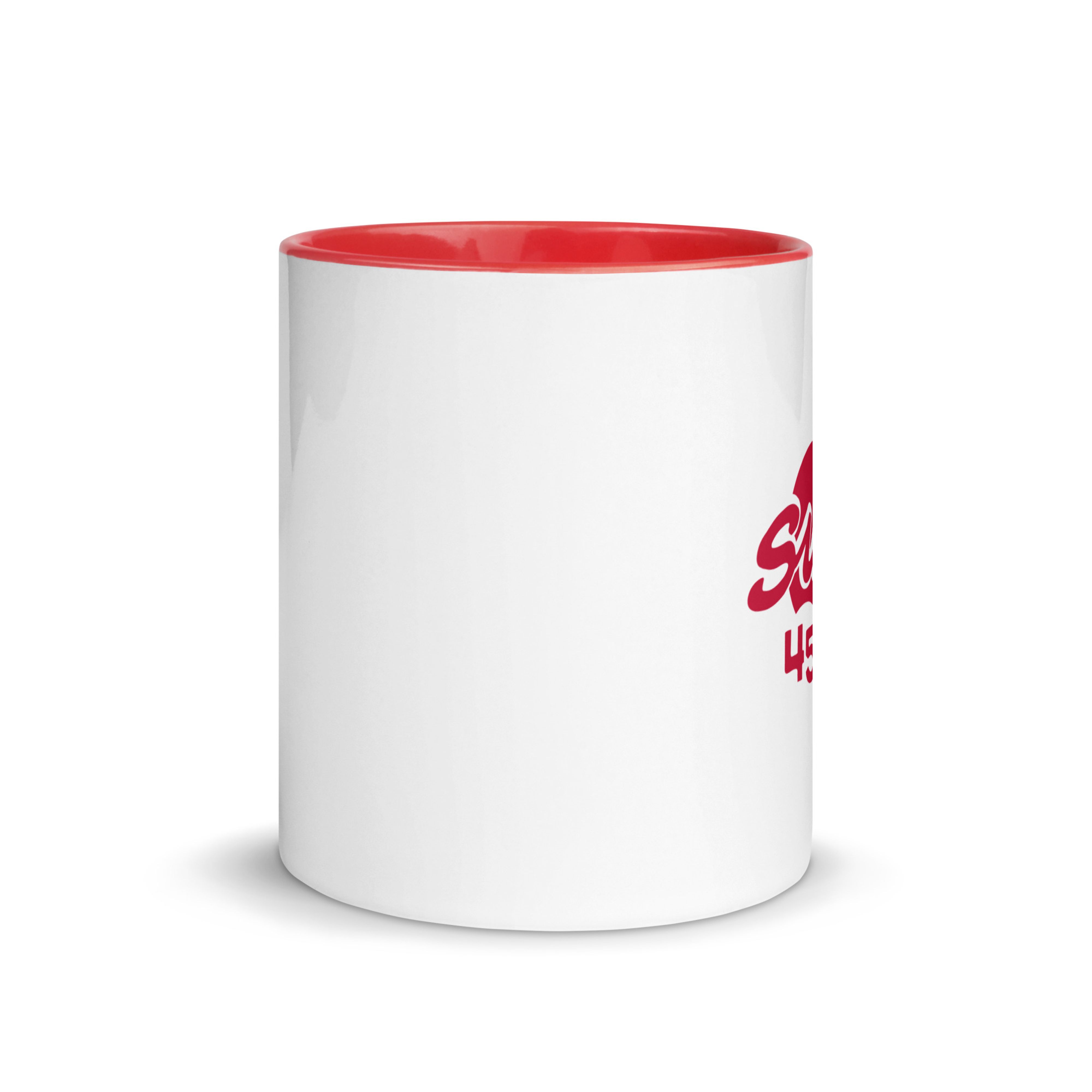 White ceramic mug with red interior and red handle, shown from the left with the red "Sun" anniversary logo partially visible on the side.