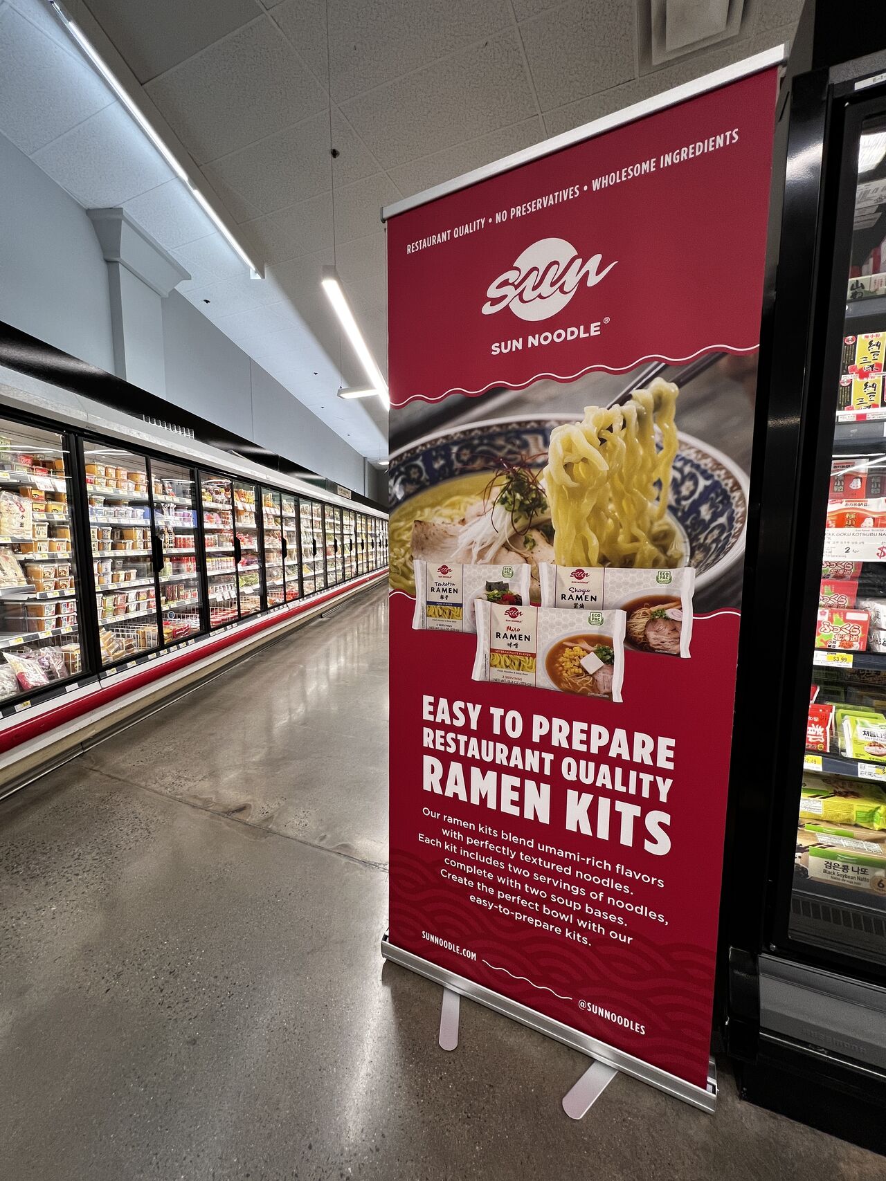 Big poster of Sun Noodle's classic line in a grocery store