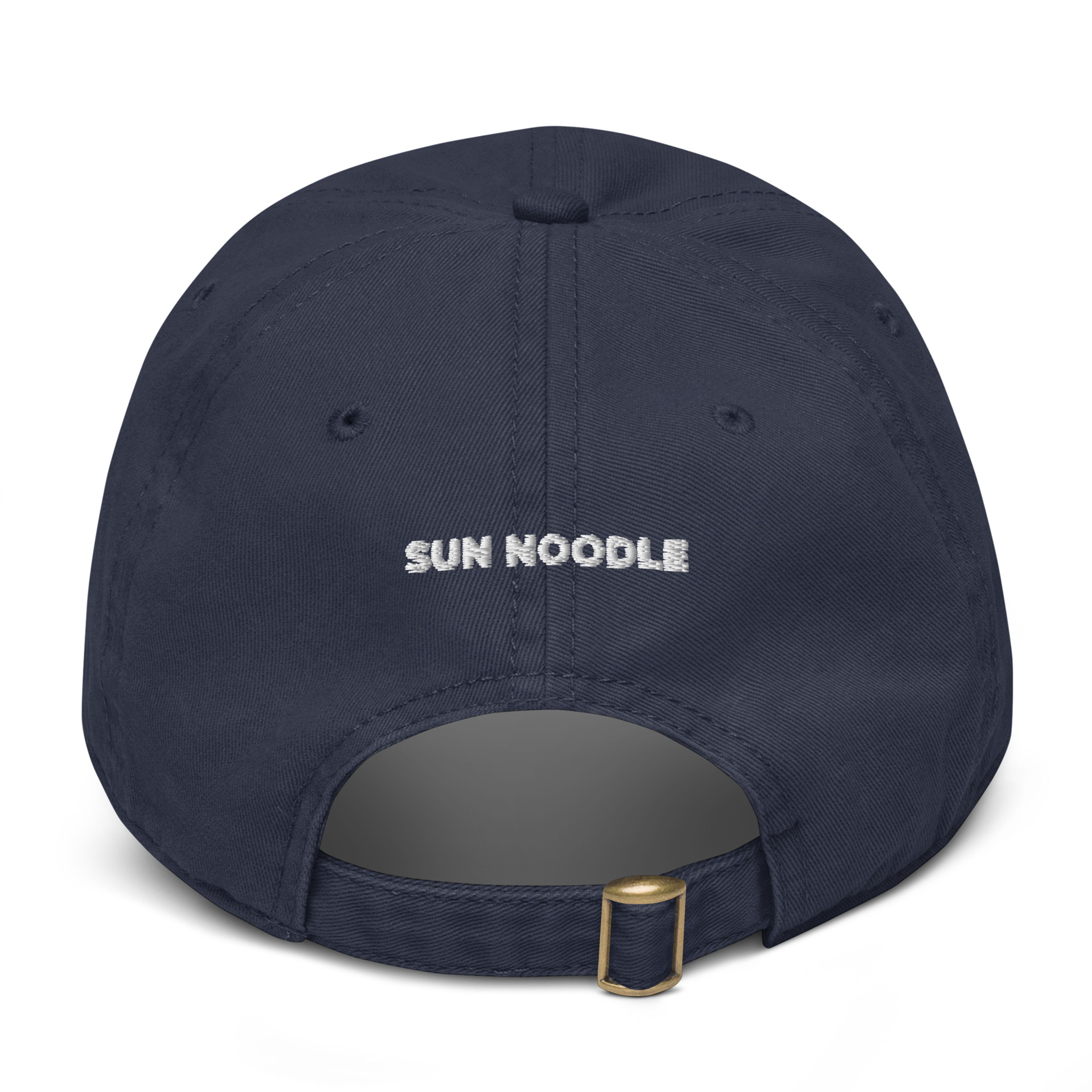 Back of the navy hat showing an adjustable strap with a gold metal buckle, with "SUN NOODLE" embroidered in small white text.