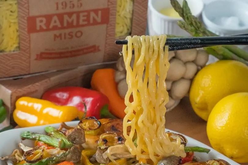 Miso ramen casserole photo with chopsticks holding ramen