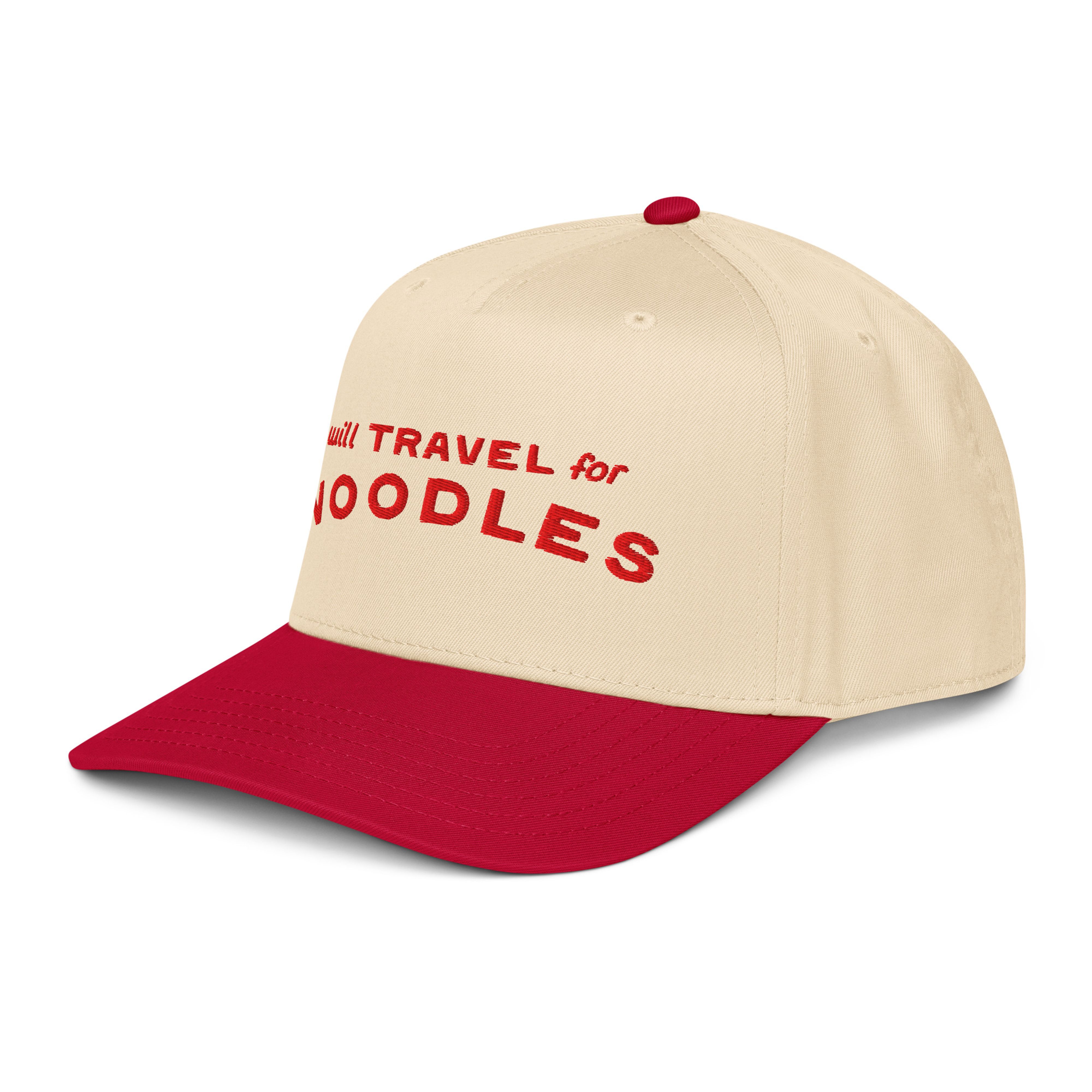 Three-quarter front view of the cream and red "will TRAVEL for NOODLES" cap, showing the red brim and side panel.