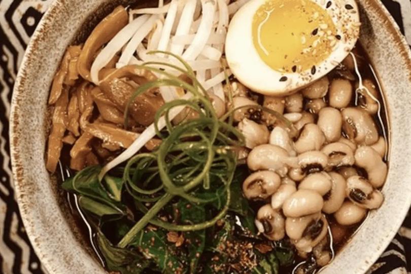 Top view of plate with black-eyed pea ramen