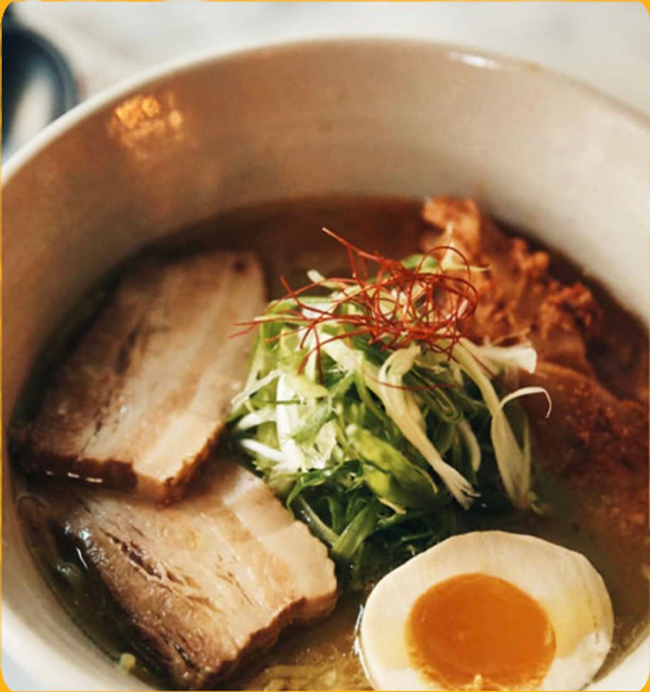 Ramen bowl with chashu, scallions and a soft egg