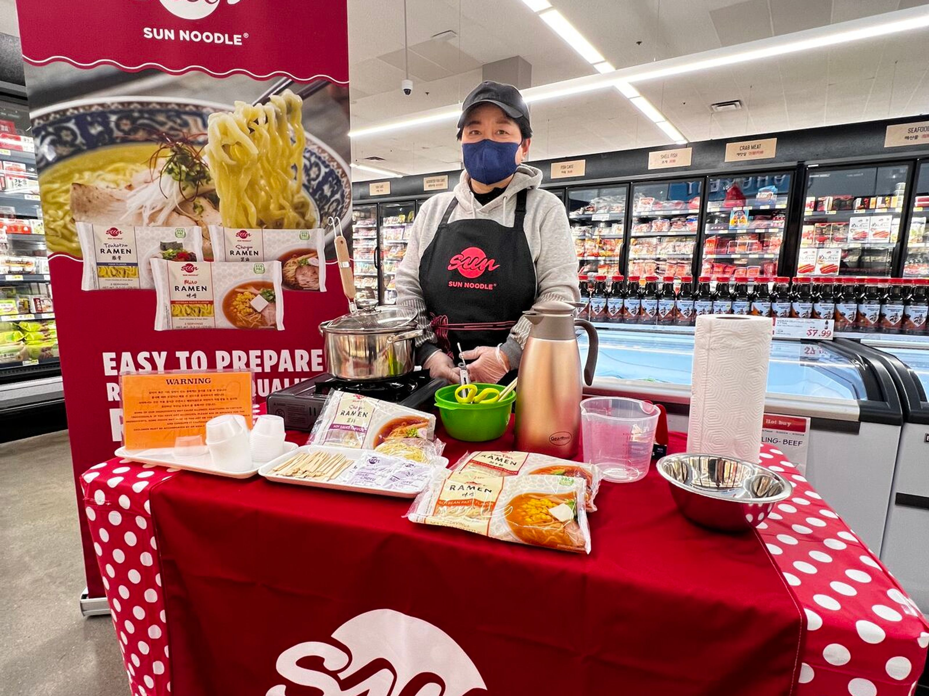 Sun Noodle employee at a grocery store 