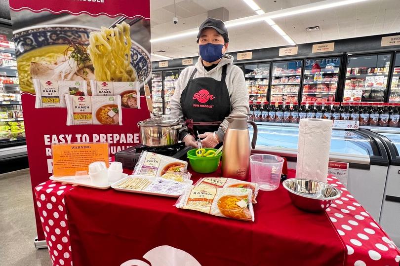 Sun Noodle employee at a grocery store 