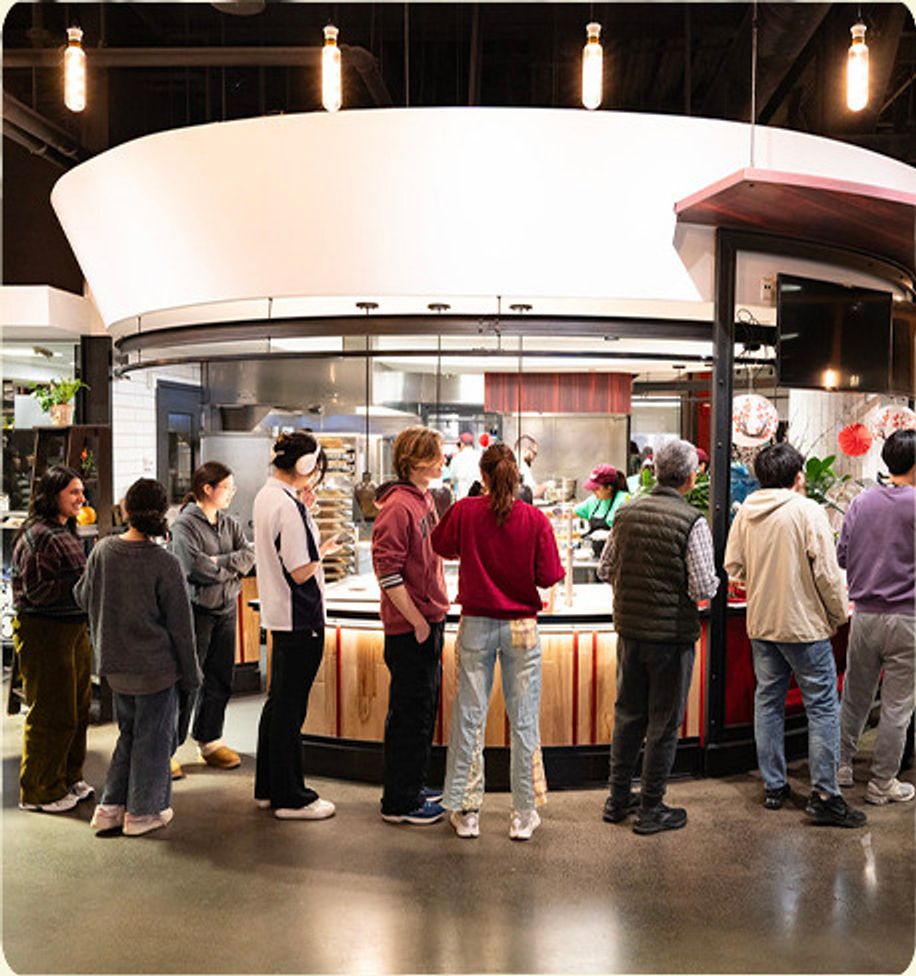 Students lined up at a campus noodle bar