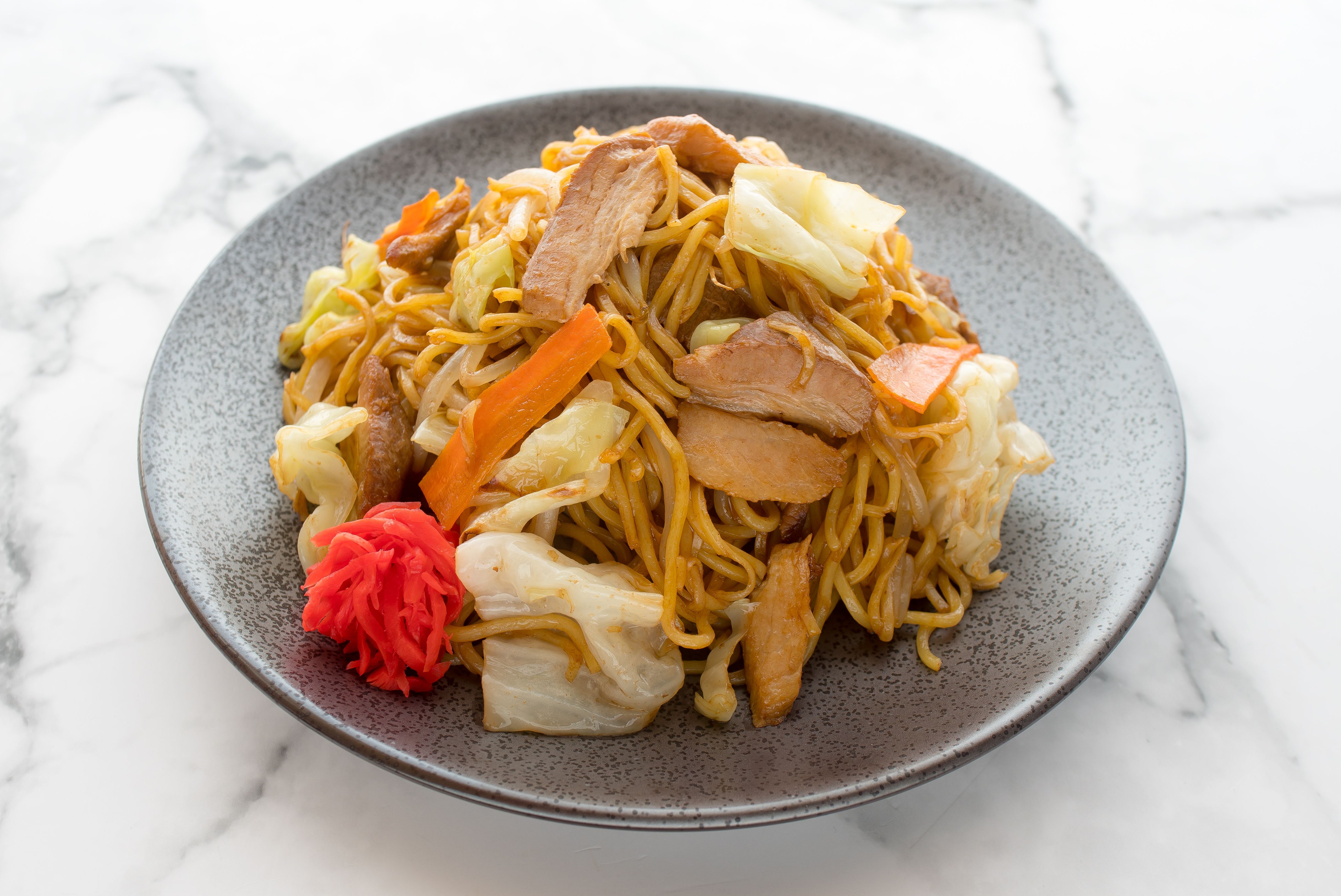 A bowl of Yakisoba with toppings