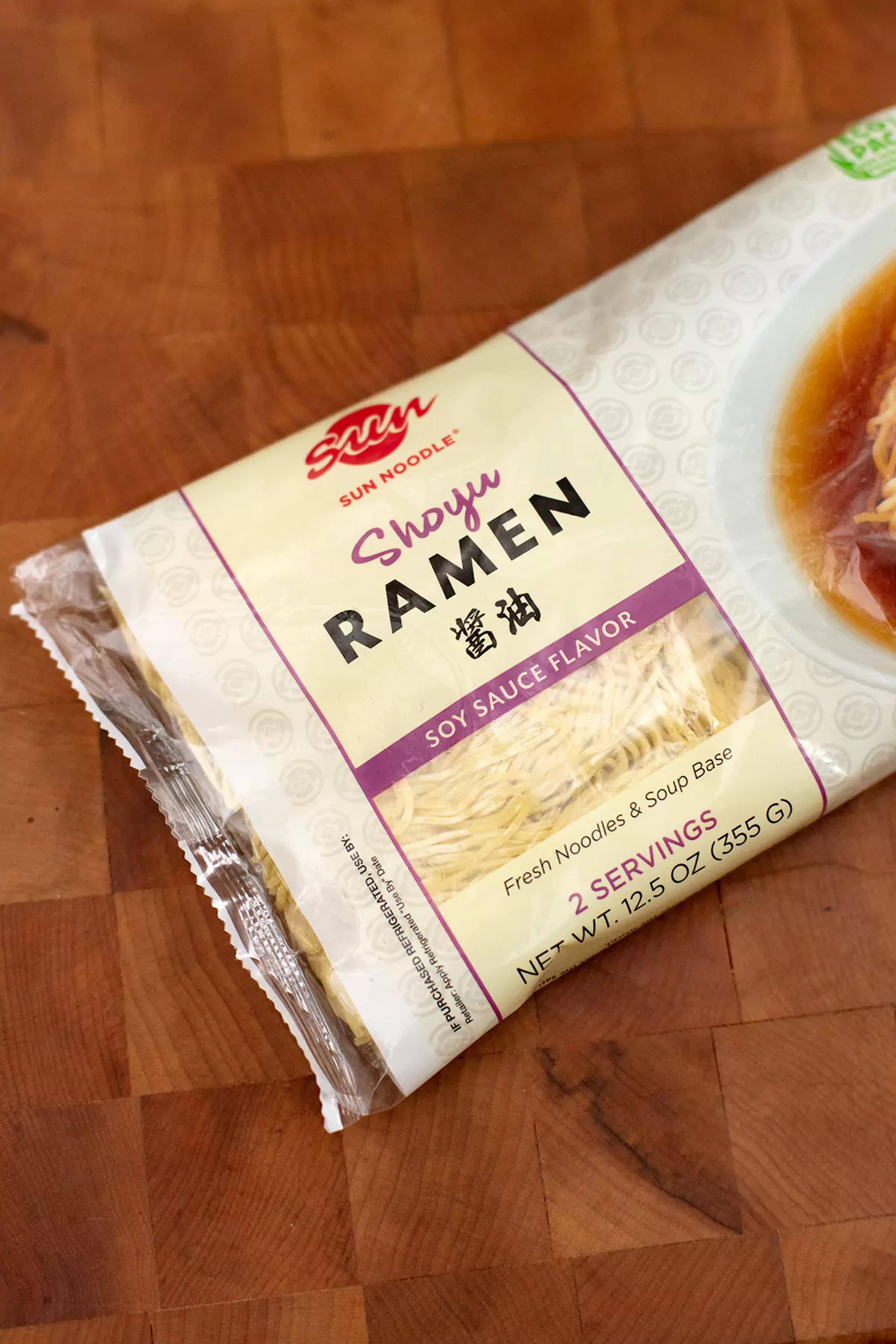 Angled view of Shoyu ramen kit on a wooden table.