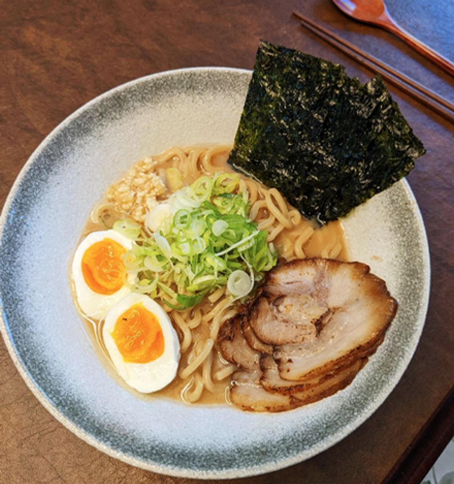 Bowl of ramen with eggs, nori and chashu