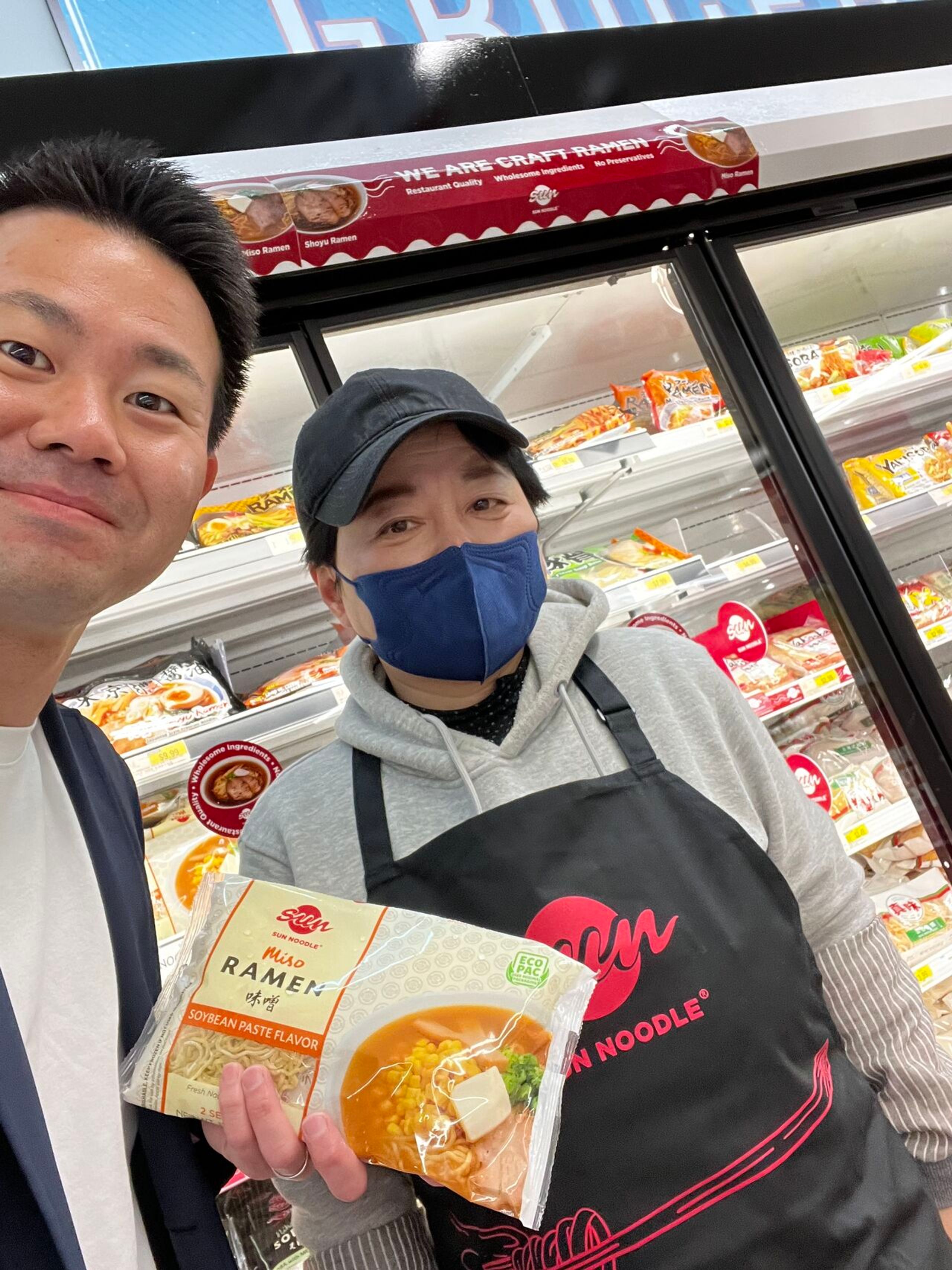 Kenshiro Uki with Sun Noodle employee holding a Miso Ramen Kit 