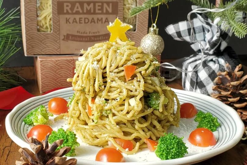 Side view of pesto ramen on a nicely decorated plate 