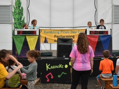 campers on stage participating in a game-show at the Rambling Pines Day Camp Performing Arts center