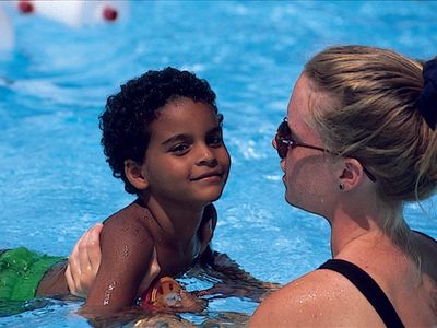 camper with swim instructor in the pool at Rambling Pines Day Camp
