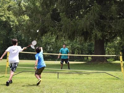 teens playing badminton at Rambling Pines Day Camp