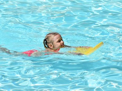 child swimming at Rambling Pines Day Camp