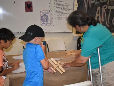 child doing woodcrafts at Rambling Pines Day Camp