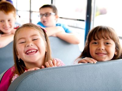 Kids on the bus to Rambling Pines Day Camp