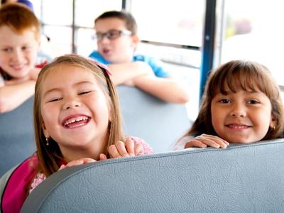 Kids on the bus to Rambling Pines Day Camp