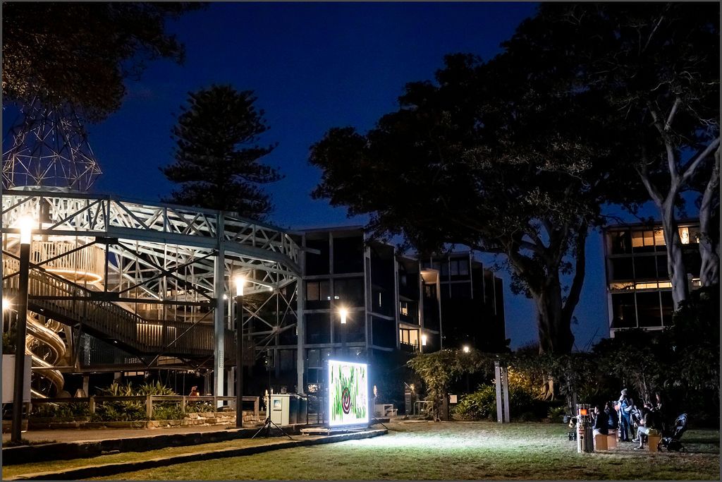 Claudia Nicholson's animated artwork Oh. screening outdoors at Inglis Park, Randwick at night