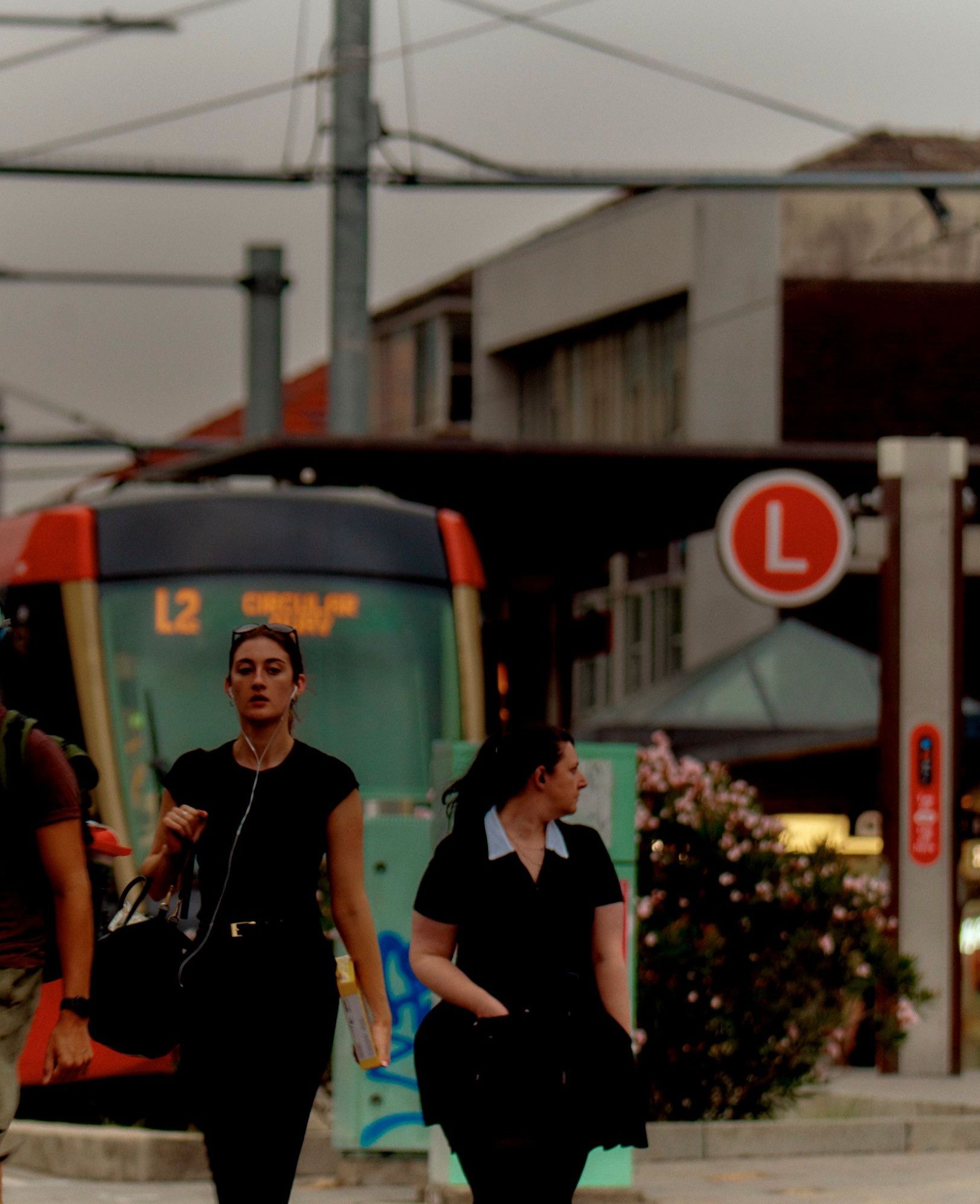Commuters walking past the Randwick Light Rail station
