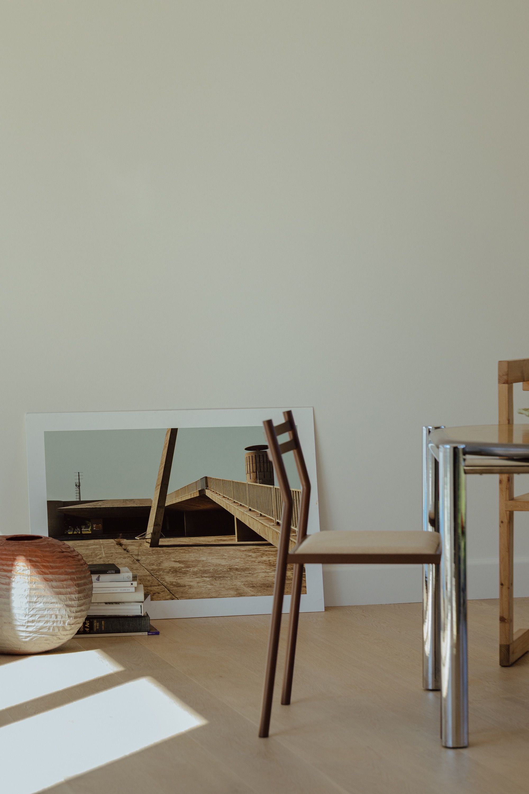 Sunlit room corner with considered furniture and artwork — RESLU, Adelaide