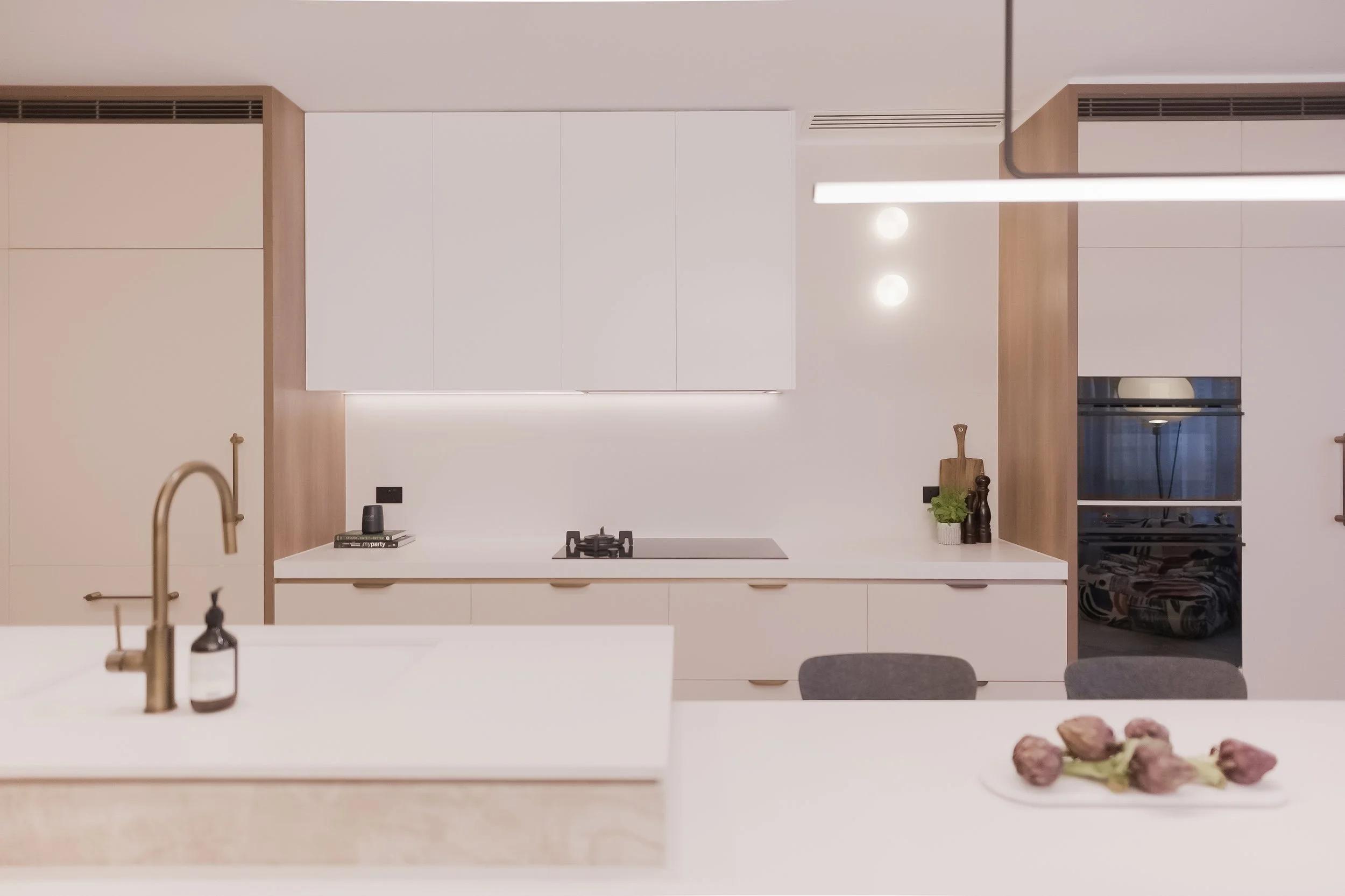 Kitchen renovation in North Adelaide by RESLU, brass tapware on stone