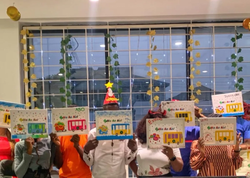 The Shuttlers team showing off paintings created during the 2021 end of year get together.