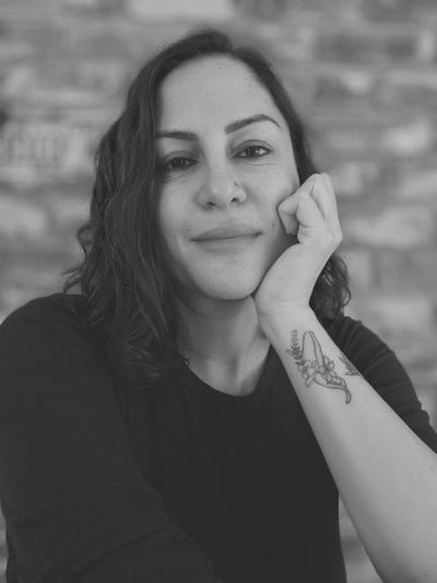 An black-and-white author photo of Zeina Hashem Beck 