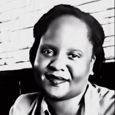 A black and white photo of Kemi Cole smiling. 